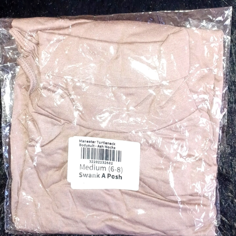 Never Worn. Didn't realize it was a full turtleneck. Wasn't as advertised